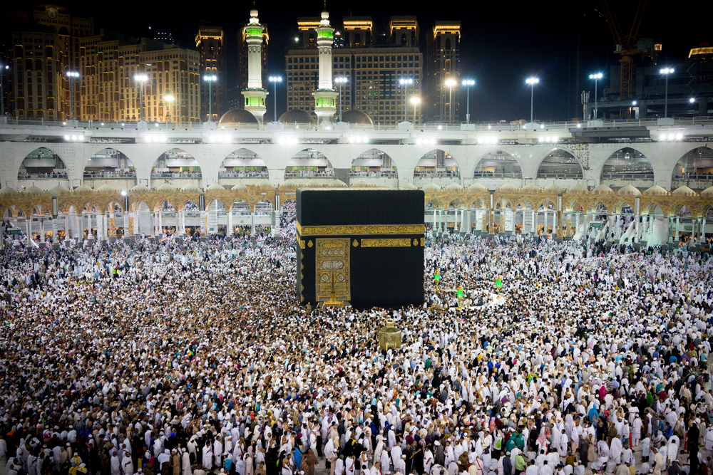 Muslim pilgrims wearing Ihram garments making the intention to perform Umrah